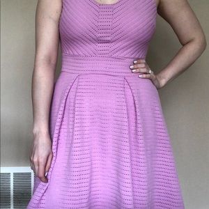 Purplish pink sleeveless dress.